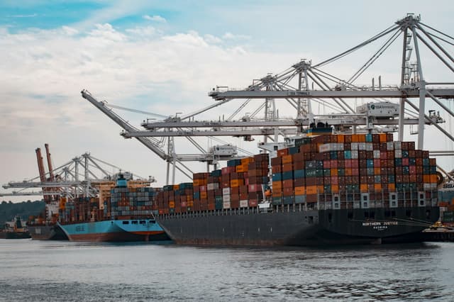 Container terminal handling export fabric rolls, the point where an FOB Ningbo shipment is loaded on board.